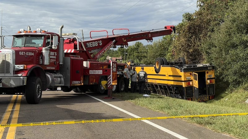In this photo provided by the Polk County Sheriff's Office, emergency personnel respond to an...
