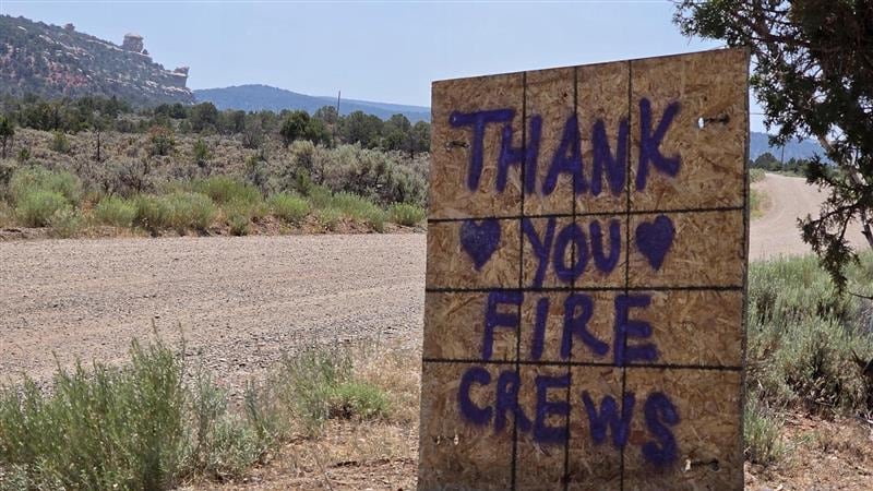 A sign which reads "Thank you fire crews," outside of the Snyder Fire on July 1, 2026.