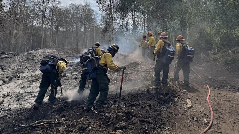 A Gold Mountain Fire crew secures a fireline on July 8, 2026.