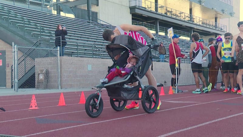 Father of two completes 5K in 16 minutes, 16 seconds while running with daughter